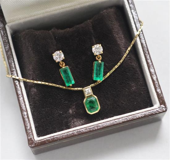 A gold, emerald and diamond pendant on a 14ct gold chain and a pair of similar gold, emerald and diamond ear studs.